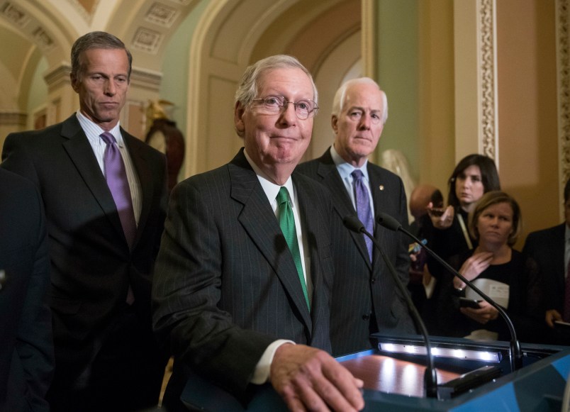 Senate Majority Leader Mitch McConnell, R-Ky., flanked by Sen. John Thune, R-S.D., left, and Majority Whip John Cornyn, R-Texas, announces to reporters that the Senate is moving ahead on a Republican budget plan, a critical step in President Donald Trump and the party's politically imperative drive to cut taxes and simplify the IRS code, at the Capitol in Washington, Tuesday, Oct. 17, 2017.  (AP Photo/J. Scott Applewhite)