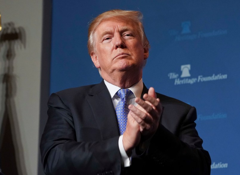 President Donald Trump applauds members of the audience before speaking at the Heritage Foundation's annual President's Club meeting, Tuesday, Oct. 17, 2017 in Washington. (AP Photo/Pablo Martinez Monsivais)