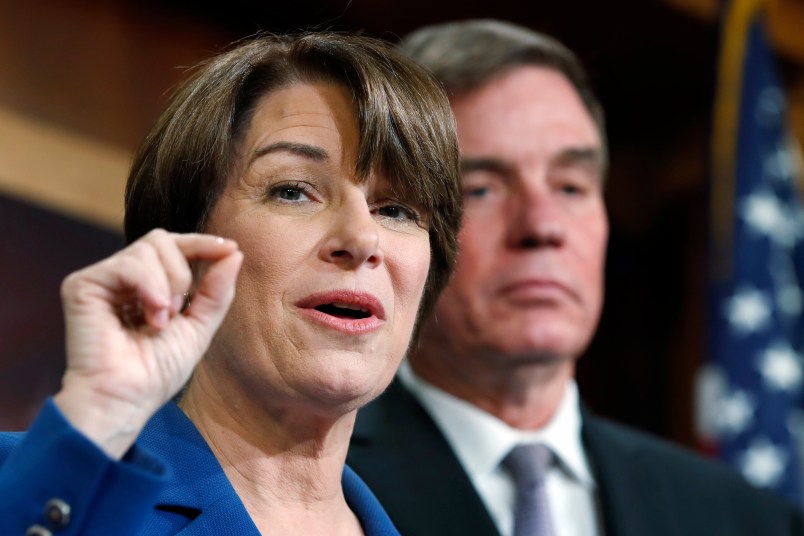 Sen. Amy Klobuchar, D-Minn., left, and Sen. Mark Warner, D-Va., speak about online political ads and preventing foreign interference in U.S. elections, during a news conference, Thursday, Oct. 19, 2017, on Capitol Hill in Washington. (AP Photo/Jacquelyn Martin)