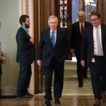 Senate Majority Leader Mitch McConnell, R-Ky., walks from the chamber to his office during a long series of votes at the Capitol in Washington, Thursday, Oct. 19, 2017. (AP Photo/J. Scott Applewhite)
