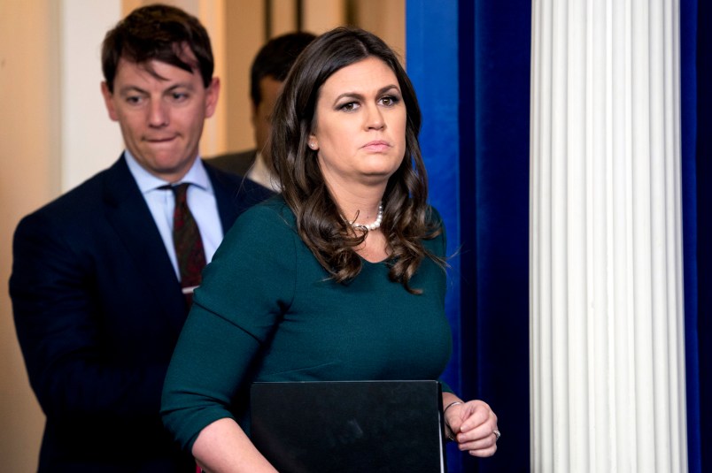 White House press secretary Sarah Huckabee Sanders, right, accompanied by deputy press secretary Hogan Gidley, left, arrives for the daily briefing in the Brady Press Briefing Room of the White House, Friday, Oct. 20, 2017, in Washington. (AP Photo/Andrew Harnik)
