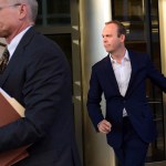 President Donald Trump's former business associate Rick Gates, right, leaves federal court in Washington, Monday, Oct. 30, 2017. (AP Photo/Susan Walsh)
