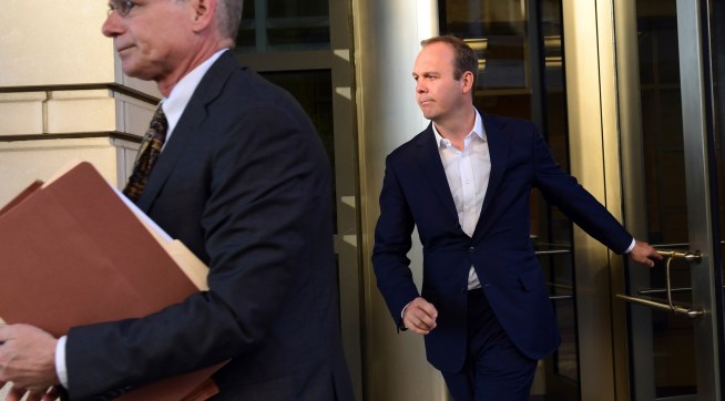 President Donald Trump's former business associate Rick Gates, right, leaves federal court in Washington, Monday, Oct. 30, 2017. (AP Photo/Susan Walsh)