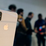 The new Apple iPhone X sits on display as consumers line up to buy the phone at the new Apple Michigan Avenue store along the Chicago River Friday, Nov. 3, 2017, in Chicago. (AP Photo/Charles Rex Arbogast)