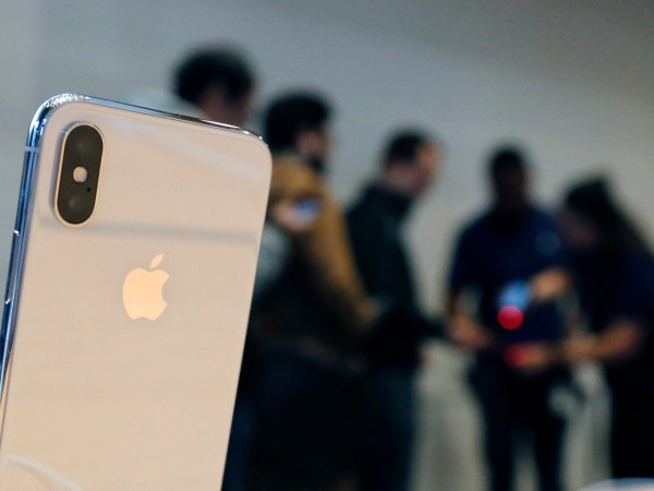 The new Apple iPhone X sits on display as consumers line up to buy the phone at the new Apple Michigan Avenue store along the Chicago River Friday, Nov. 3, 2017, in Chicago. (AP Photo/Charles Rex Arbogast)