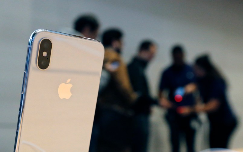 The new Apple iPhone X sits on display as consumers line up to buy the phone at the new Apple Michigan Avenue store along the Chicago River Friday, Nov. 3, 2017, in Chicago. (AP Photo/Charles Rex Arbogast)