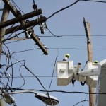 In this Thursday, Oct. 19, 2017 photo, a brigade from the Electric Power Authority repairs distribution lines damaged by the passage of Hurricane Maria in the Cantera community of San Juan, Puerto Rico. The storm struck after the Puerto Rico Electric Power Authority had filed for bankruptcy in July, put off badly needed maintenance and had just finished dealing with outages from Hurricane Irma. (AP Photo/Carlos Giusti)