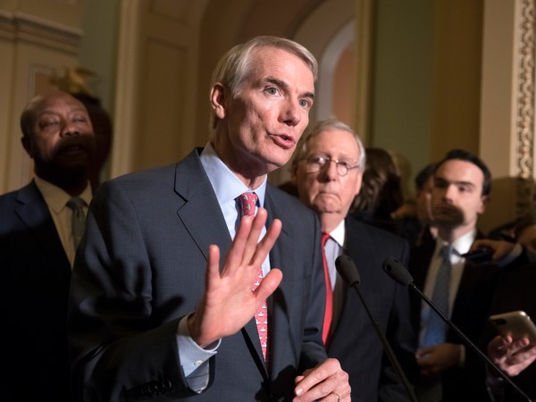Sen. Rob Portman, R-Ohio, a member of the Senate Finance Committee, joins Sen.Tim Scott, R-S.C., left, and Majority Leader Mitch McConnell, R-Ky., to talk about work on overhauling the nation's tax code, on Capitol Hill in Washington, Tuesday, Nov. 14, 2017. (AP Photo/J. Scott Applewhite)