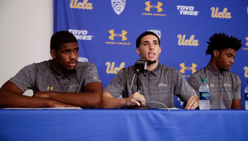 Flanked by teammates Cody Riley, left, and Jalen Hill, UCLA basketball player LiAngelo Ball reads his statement during a news conference at UCLA Wednesday, Nov. 15, 2017, in Los Angeles. The three players were detained in Hangzhou following allegations of shoplifting last week before a game against Georgia Tech in Shanghai. (AP Photo/Jae C. Hong)