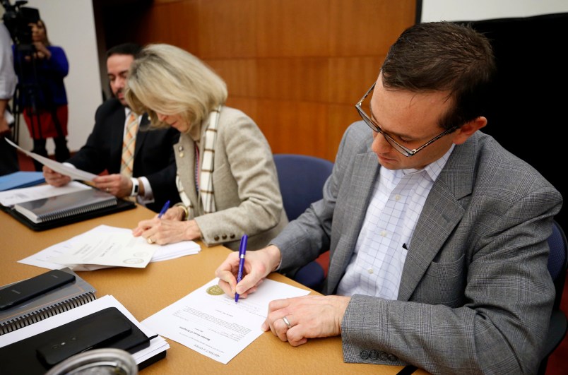 James B. Alcorn, at right, chairman of The Virginia State Board of Elections certifies the results in the contested 28th and 88th House of Delegates Districts elections. Getting the nod in the 28th, Republican  Robert M. Thomas Jr. was selected to replace retiring GOP Speaker William J. Howell and in the 88th, incumbent Mark Cole (R-Spotsylvania) will return in January. At left is board member Edgardo Cortes and Vice-Chair Clara Bell Wheeler. The board met in Richmond, Virginia on Monday, November 27, 2017.