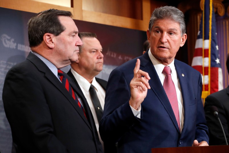 Sen. Joe Manchin, D-W.Va., right, with Sen. Joe Donnelly, D-Ind., left, and Sen. Jon Tester, D-Mont., speaks about tax reform, Tuesday, Nov. 28, 2017, on Capitol Hill in Washington. (AP Photo/Jacquelyn Martin)