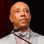 Russell Simmons speaks on stage at the RUSH Philanthropic Arts Foundation’s Art for Life Benefit at Fairview Farms in Water Mill on Saturday, July 18, 2015, in New York. (Photo by Scott Roth/Invision/AP)