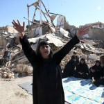 A woman moans on the earthquake site in Sarpol-e-Zahab in western Iran, Tuesday, Nov. 14, 2017. Rescuers are digging through the debris of buildings felled by the Sunday earthquake that killed more than four hundred people in the border region of Iran and Iraq. (AP Photo/Vahid Salemi)