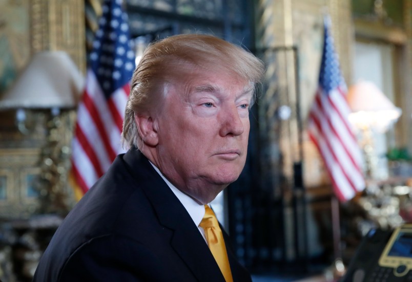 President Donald Trump pauses while speaking to the media before speaking with troops via video conference at Mar-a-Lago, on Thanksgiving, Thursday, Nov. 23, 2017, in Palm Beach, Fla. (AP Photo/Alex Brandon)