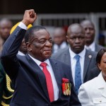 Emmerson Mnangagwa, center, and his wife Auxillia, right, arrive at the presidential inauguration ceremony in the capital Harare, Zimbabwe Friday, Nov. 24, 2017. Mnangagwa is being sworn in as Zimbabwe’s president after Robert Mugabe resigned on Tuesday, ending his 37-year rule. (AP Photo/Ben Curtis)