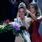 Formers Miss Universe Iris Mittenaere, right, crowns new Miss Universe Demi-Leigh Nel-Peters at the Miss Universe pageant Sunday, Nov. 26, 2017, in Las Vegas. (AP Photo/John Locher)