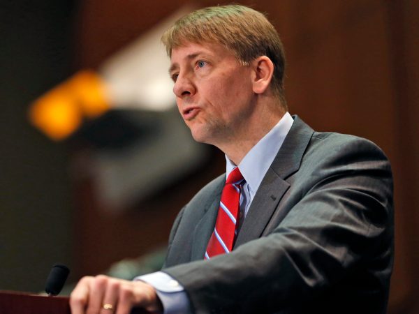 FILE - In this March 26, 2015, file photo, Consumer Financial Protection Bureau (CFPB) Director, Richard Cordray, speaks during a panel discussion in Richmond, Va. The CFPB is considering banning a practice known as forced arbitration for financial services. (AP Photo/Steve Helber, File)
