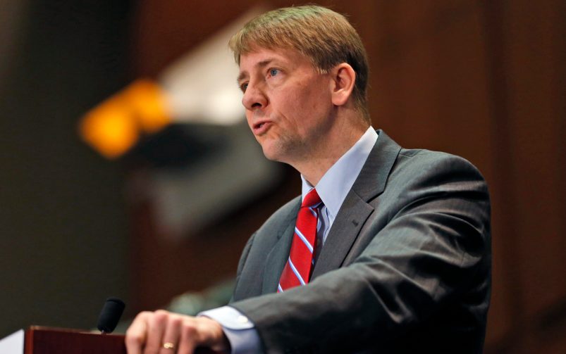 FILE - In this March 26, 2015, file photo, Consumer Financial Protection Bureau (CFPB) Director, Richard Cordray, speaks during a panel discussion in Richmond, Va. The CFPB is considering banning a practice known as forced arbitration for financial services. (AP Photo/Steve Helber, File)