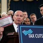 House Ways and Means Committee Chairman Kevin Brady, R-Texas, joined by Speaker of the House Paul Ryan, R-Wis., right, holds a proposed "postcard tax filing form" as they unveil the GOP's far-reaching tax overhaul, the first major revamp of the tax system in three decades, on Capitol Hill in Washington, Thursday, Nov. 2, 2017.  (AP Photo/J. Scott Applewhite)