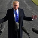 President Donald Trump talks with reporters as he departs from the South Lawn of the White House via Marine One in Washington, Saturday, Dec. 16, 2017, to spend the weekend at Camp David in Maryland. (AP Photo/Susan Walsh)