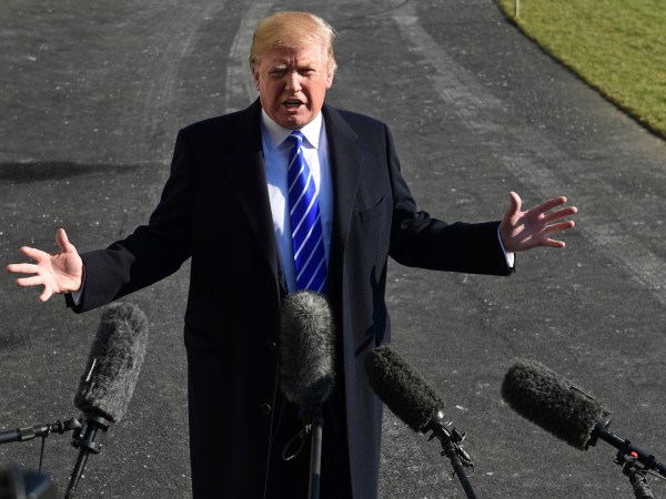 President Donald Trump talks with reporters as he departs from the South Lawn of the White House via Marine One in Washington, Saturday, Dec. 16, 2017, to spend the weekend at Camp David in Maryland. (AP Photo/Susan Walsh)