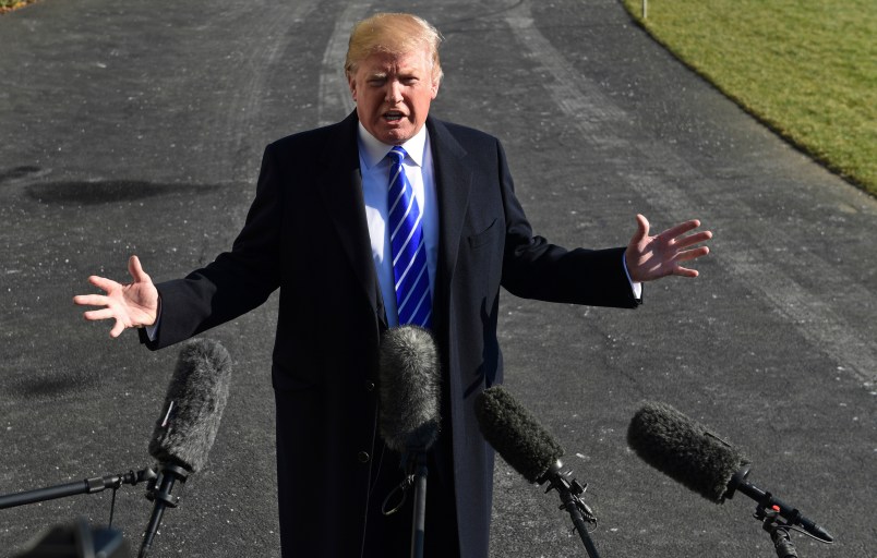 President Donald Trump talks with reporters as he departs from the South Lawn of the White House via Marine One in Washington, Saturday, Dec. 16, 2017, to spend the weekend at Camp David in Maryland. (AP Photo/Susan Walsh)