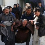 An Afghan man, center, cry after after a suicide attack in Kabul, Afghanistan, Thursday, Dec. 28, 2017. Authorities say two simultaneous attacks, including a suicide bombing attack, in Afghanistan’s capital have left at least 35 dead and 20 wounded. (AP Photo/Rahmat Gul)