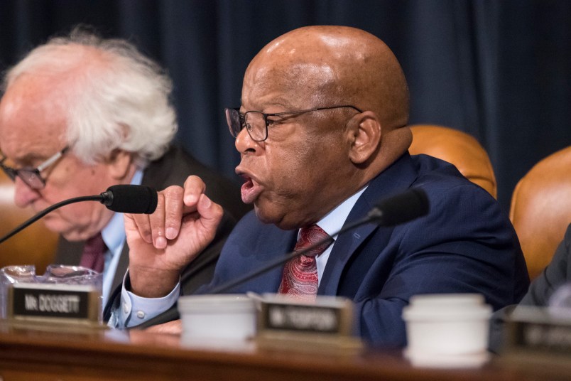 Rep. John Lewis, D-Ga., joined at left by Rep. Sander Levin, D-Mich., makes a point as the House Ways and Means Committee continues its debate over the Republican tax reform package, on Capitol Hill in Washington, Wednesday, Nov. 8, 2017. (AP Photo/J. Scott Applewhite)