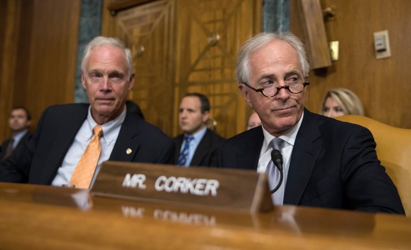 Senate Budget Committee members Sen. Bob Corker, R-Tenn., right, and Sen. Ron Johnson, R-Wis., left  attend a Senate Budget Committee hearing to consider fiscal year 2018 reconciliation legislation on Capitol Hill in Washington, Tuesday, Nov. 28, 2017. The Senate Budget Committee has advanced a sweeping tax package to the full Senate, handing GOP leaders a victory as they try to pass the nation's first tax overhaul in 31 years. (AP Photo/Carolyn Kaster)