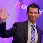 Donald Trump Jr. waves to the audience during a fundraiser for Kansas Secretary of State Kris Kobach's campaign for governor Tuesday, Nov. 28, 2017, in Overland Park, Kan. (AP Photo/Charlie Riedel)