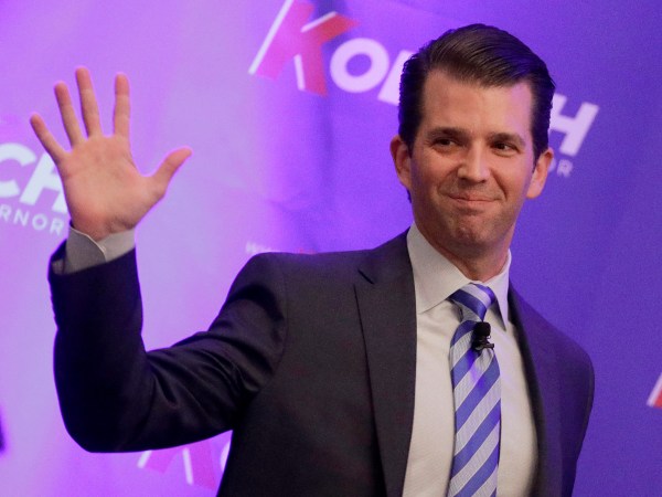 Donald Trump Jr. waves to the audience during a fundraiser for Kansas Secretary of State Kris Kobach's campaign for governor Tuesday, Nov. 28, 2017, in Overland Park, Kan. (AP Photo/Charlie Riedel)