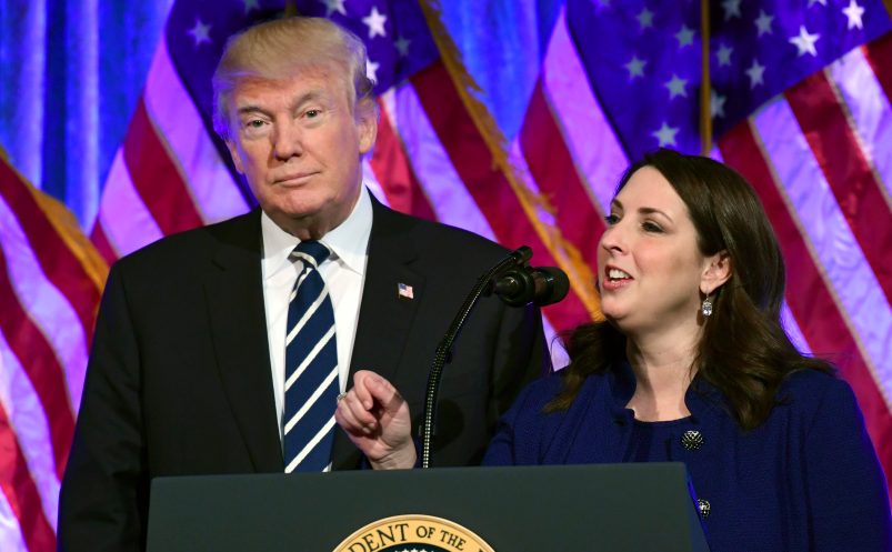 President Donald Trump, left, listens as Republican Nantional Committee chairwoman Ronna Romney McDaniel, right, speaks at a fundraiser at Cipriani in New York, Saturday, Dec. 2, 2017. Trump is attending a trio of fundraisers during his day in New York. (AP Photo/Susan Walsh)