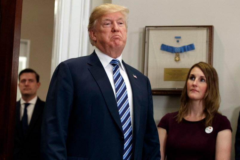 President Donald Trump pauses as he speaks to reporters during an event on federal regulations in the Roosevelt Room of the White House, Thursday, Dec. 14, 2017, in Washington. (AP Photo/Evan Vucci)
