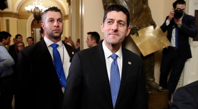 House Speaker Paul Ryan of Wis., center, leaves the House Chamber after voting yes on the Republican tax bill, Tuesday, Dec. 19, 2017, on Capitol Hill in Washington. (AP Photo/Jacquelyn Martin)