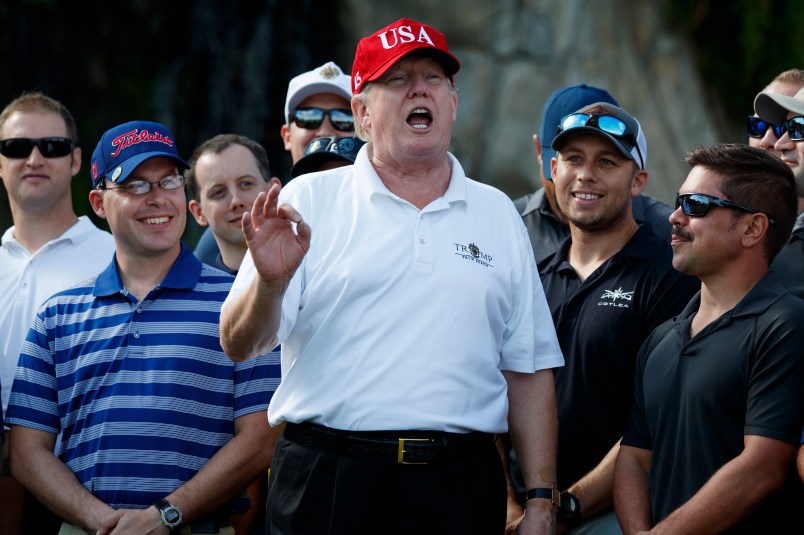 President Donald Trump speaks as he meets with members of the Coast Guard who he invited to play golf at Trump International Golf Club, Friday, Dec. 29, 2017, in West Palm Beach, Fla. (AP Photo/Evan Vucci)