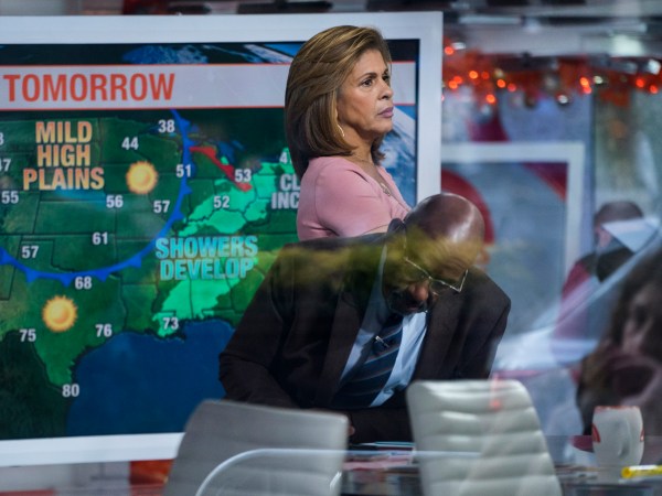 Anchor Hoda Kotb, with co-anchor Al Roker, lower center, stands on the set of the Today Show between segments Wednesday, Nov. 29, 2017, in New York, in the wake of the firing of ‘Today’ co-anchor Matt Lauer. NBC News fired the longtime host on Wednesday for "inappropriate sexual behavior," making him the second morning television show personality to lose his job because of sexual misconduct charges in a week. (AP Photo/Craig Ruttle)