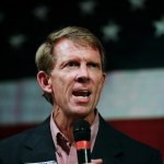 In this  Monday, Sept. 25, 2017, photo, Rich Hobson, left, speaks to the crowd at a U.S. Senate candidate Roy Moore rally in Fairhope, Ala. (AP Photo/Brynn Anderson)