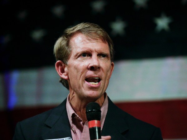 In this  Monday, Sept. 25, 2017, photo, Rich Hobson, left, speaks to the crowd at a U.S. Senate candidate Roy Moore rally in Fairhope, Ala. (AP Photo/Brynn Anderson)