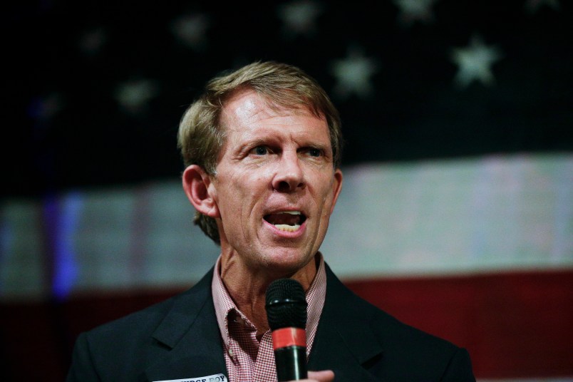 In this  Monday, Sept. 25, 2017, photo, Rich Hobson, left, speaks to the crowd at a U.S. Senate candidate Roy Moore rally in Fairhope, Ala. (AP Photo/Brynn Anderson)