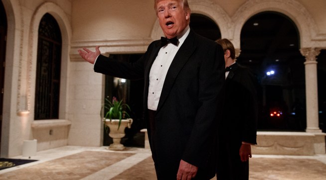 President Donald Trump speaks with reporters as he arrives for a New Year's Eve gala at his Mar-a-Lago resort, Sunday, Dec. 31, 2017, in Palm Beach, Fla. (AP Photo/Evan Vucci)