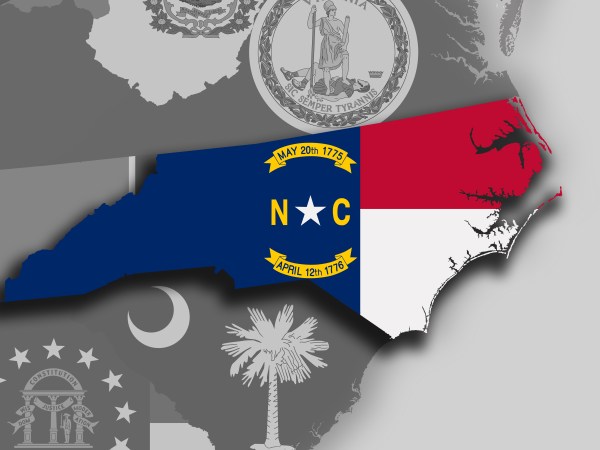 Illustration of the State of North Carolina silhouette map and flag. Its a JPG image.
