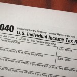 MIAMI, FL - DECEMBER 22:  A copy of a IRS 1040 tax form is seen at an H&R Block office on the day President Donald Trump signed the Republican tax cut bill in Washington, DC  on December 22, 2017 in Miami, Florida. Kathy Pickering, vice president of regulatory affairs and executive director of The Tax Institute at H&R Block released a statement about the new tax bill saying, " ItÕs going to change the way you think about and plan your income taxes. YouÕll need to take a fresh look at your individual situation to know your outcome and new strategies to use to get the best tax outcome.Ó  (Photo by Joe Raedle/Getty Images)