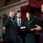 Doug Jones, second from left, the first Alabama Democrat elected to the Senate in a quarter century, is administered the oath of office by Vice President Mike Pence as his wife Louise holds the Bible, joined at far left by their son Christopher Jones, and son Carson Jones, center, during a ceremonial swearing-in at the Capitol in Washington, Wednesday, Jan. 3, 2018. Jones, 63, will represent one of the most conservative states in the nation and is stressing his desire to work with both parties. Jones defeated Republican Roy Moore in a special election to take the seat once held by Attorney General Jeff Sessions. (AP Photo/J. Scott Applewhite)