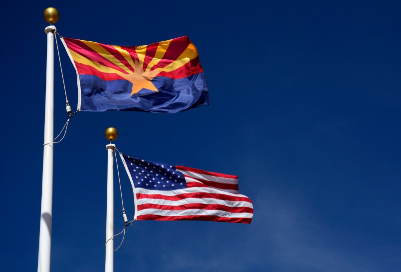 CANYON DE CHELLY, AZ - MARCH 18, 2017:  The Arizona state flag flies beside the United States flag at the Visitor Center at Canyon de Chelly National Monument near Chinle, Arizona. Established in 1931, the monument is jointly managed by the National Park Service and the Navajo Nation. The monument is entirely on Navajo tribal lands in northeastern Arizona. (Photo by Robert Alexander/Getty Images)
