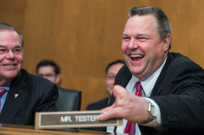 UNITED STATES - JANUARY 23: Sens. Bob Menendez, D-N.J., and Jon Tester, D-Mont., are seen during a Senate Banking, Housing and Urban Affairs Committee hearing in Dirksen Building on the nominations of Jelena McWilliams, Marvin Goodfriend, and Thomas Workman on January 23, 2018. (Photo By Tom Williams/CQ Roll Call)