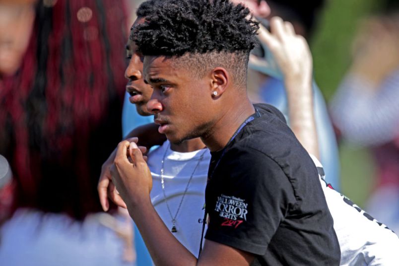 Students are released from a lockdown outside of Stoneman Douglas High School in Parkland, Fla. after reports of an active shooter on Wednesday, Feb. 14, 2018. (John McCall/Sun Sentinel/TNS)