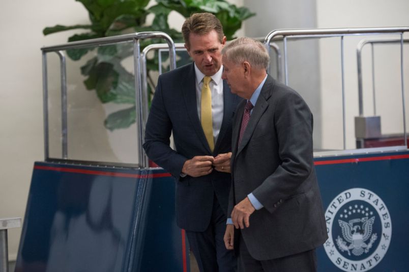 UNITED STATES - SEPTEMBER 07: Sens. Jeff Flake, R-Ariz., left, and Lindsey Graham, R-S.C., make their way to a Hurricane Harvey aid related vote in the Capitol on September 7, 2017. (Photo By Tom Williams/CQ Roll Call)