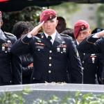 Members of the 3rd Special Forces Group Airborne 2nd Battalion leave pins and salute the casket after the burial of Army Sgt. La David Johnson at Fred Hunter's Hollywood Memorial Gardens in Hollywood, Fla., on Saturday, Oct. 21, 2017. (Mike Stocker/Sun Sentinel/TNS)