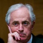 WASHINGTON, DC - JANUARY 30:  Senator Bob Corker (R-TN) looks on as Treasury Secretary Steven Mnuchin delivers the annual financial stability report to the Senate Banking, Housing and Urban Affairs Committee on January 30, 2018 in Washington, DC. Mnuchin said the Treasury can extend the government's debt limit suspension period into February before it exhausts its borrowing ability.  (Photo by Pete Marovich/Getty Images)