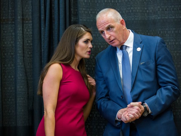 DERRY, NH  - AUGUST 19:   Hope Hicks is Republican Presidential candidate Donald Trump's campaign spokeswoman,  speaks with with head of security Keith Schiller, at a campaign event,  August 19, 2015 in Derry, NH.  (Photo by Brooks Kraft/ Getty Images)